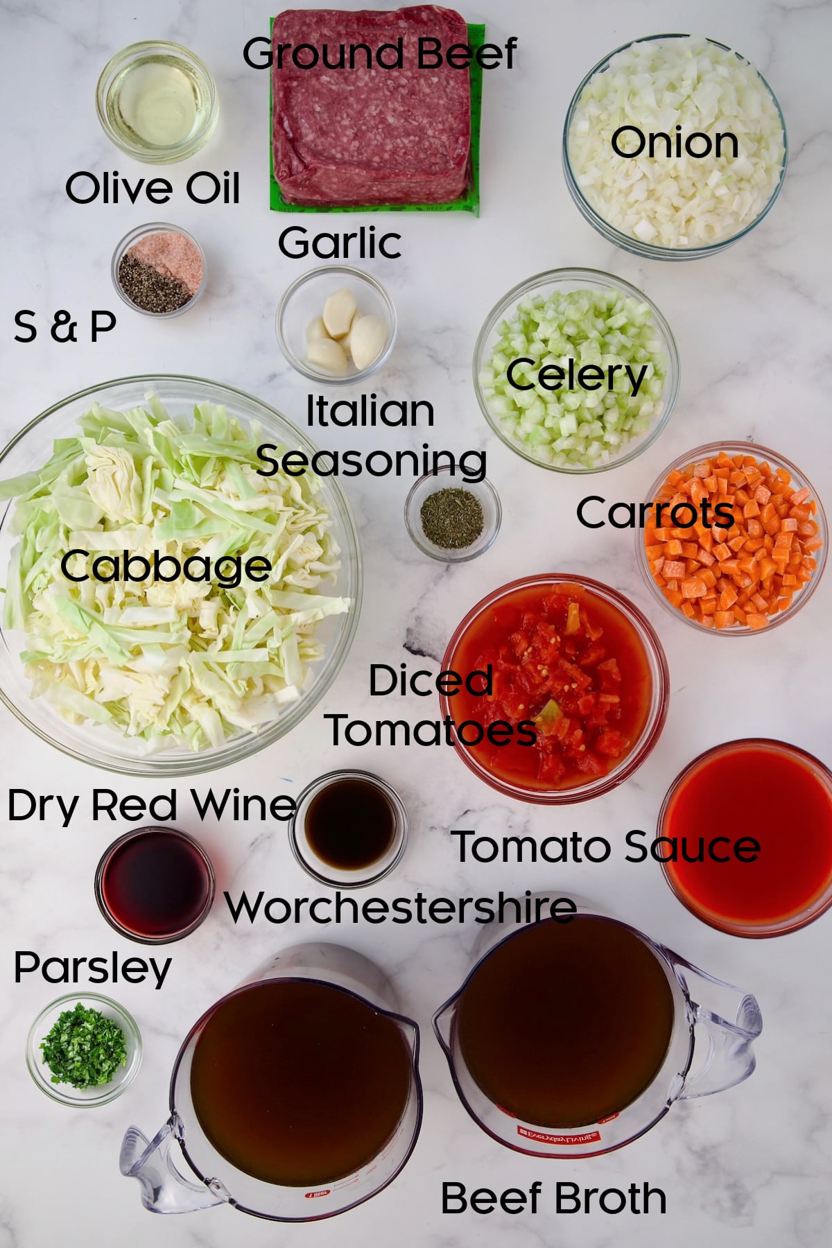 Ingredients for Beef and Cabbage Soup in glass bowls.
