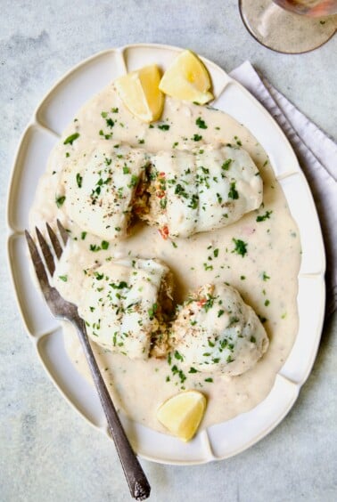Two servings of Crab-Stuffed Flounder on oval platter.