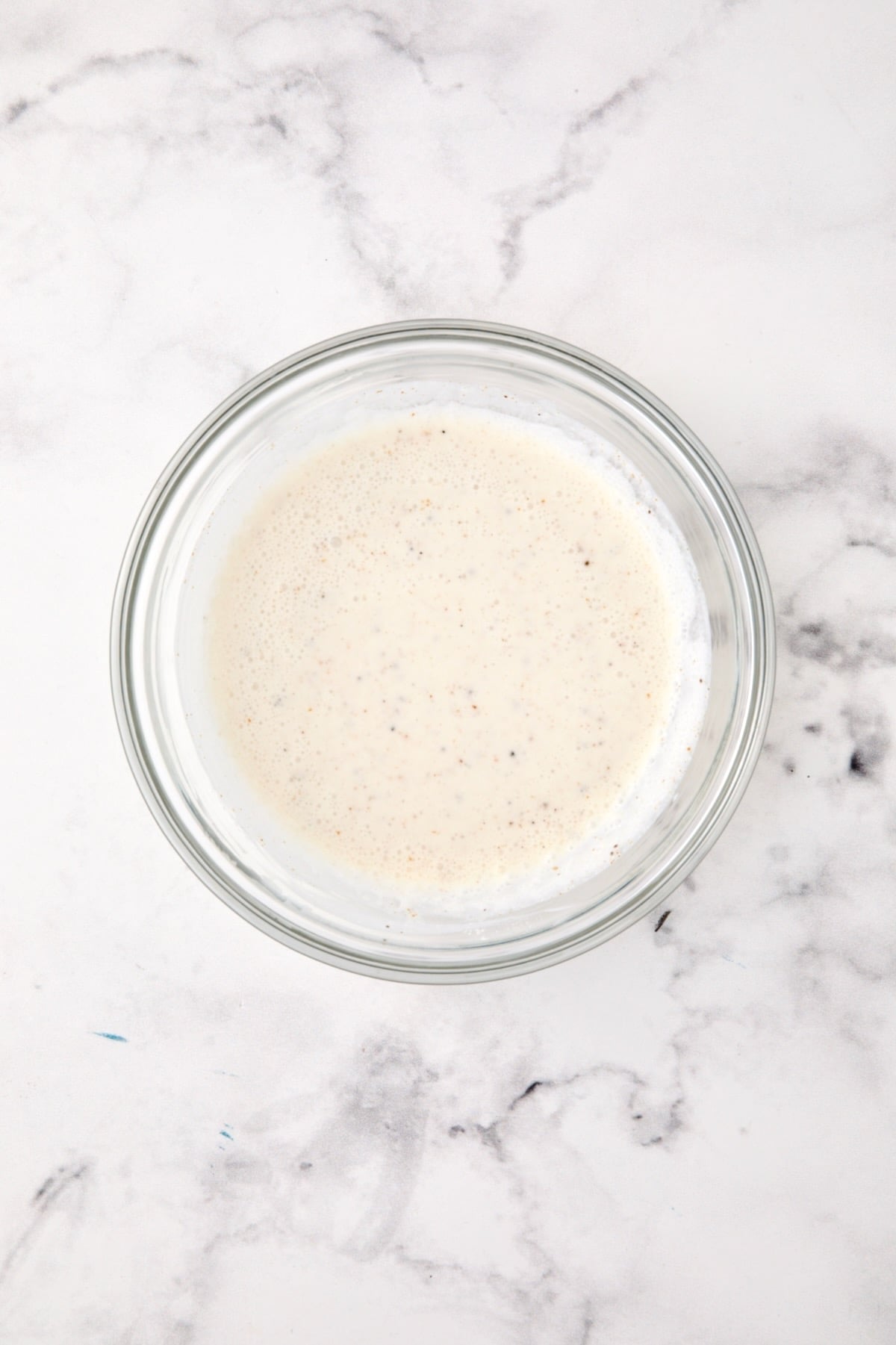 Wine and cream sauce in glass bowl.