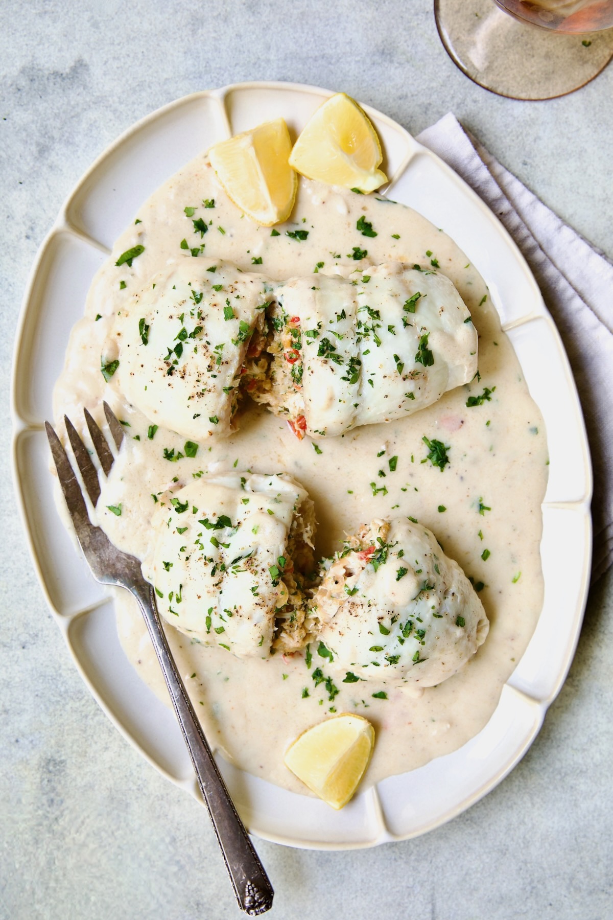 Two servings of Crab-Stuffed Flounder on oval platter.