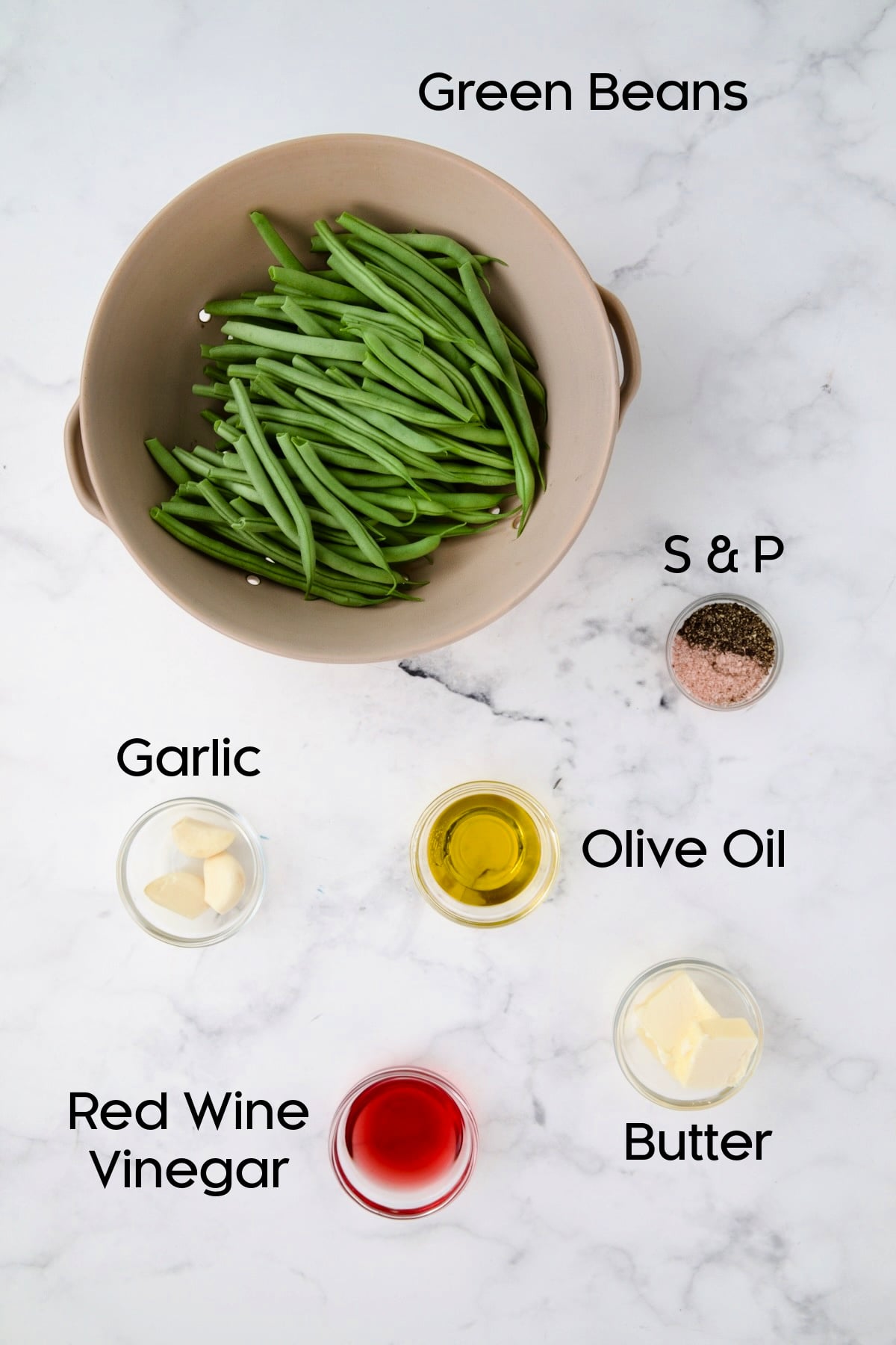 Ingredients for Garlic Green Beans in glass bowls.