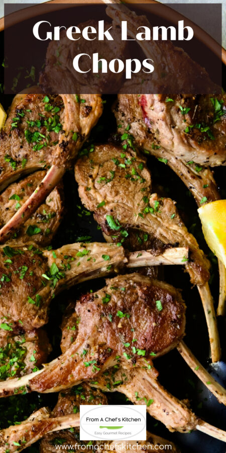 Pinterest graphic for Greek Lamb Chops showing them on a black platter garnished with lemon wedges.