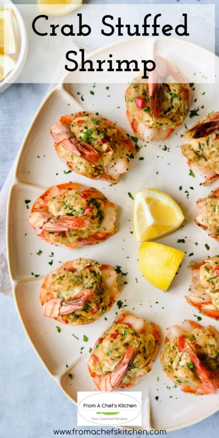 Pinterest graphic for Crab Stuffed Shrimp showing it on an oval platter garnished with lemon wedges.