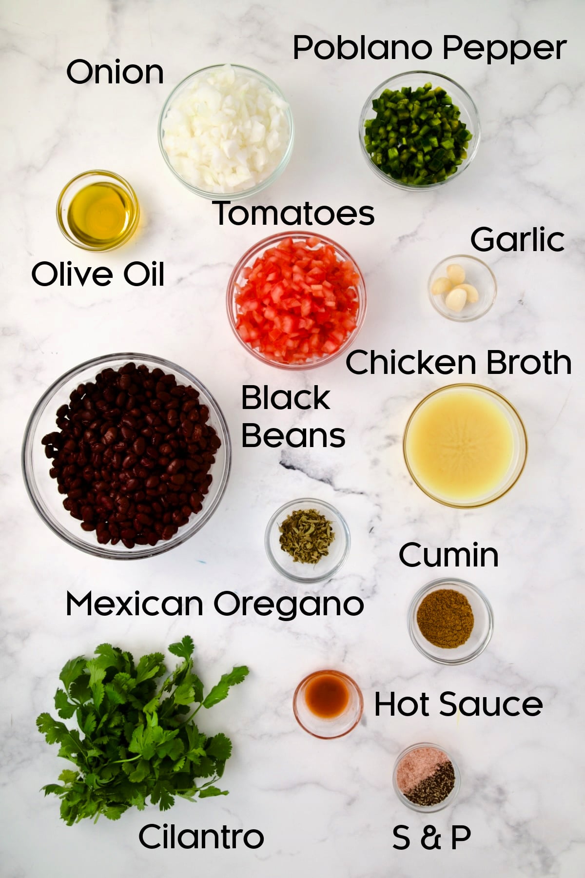 Ingredients for black bean side dish in glass bowls.