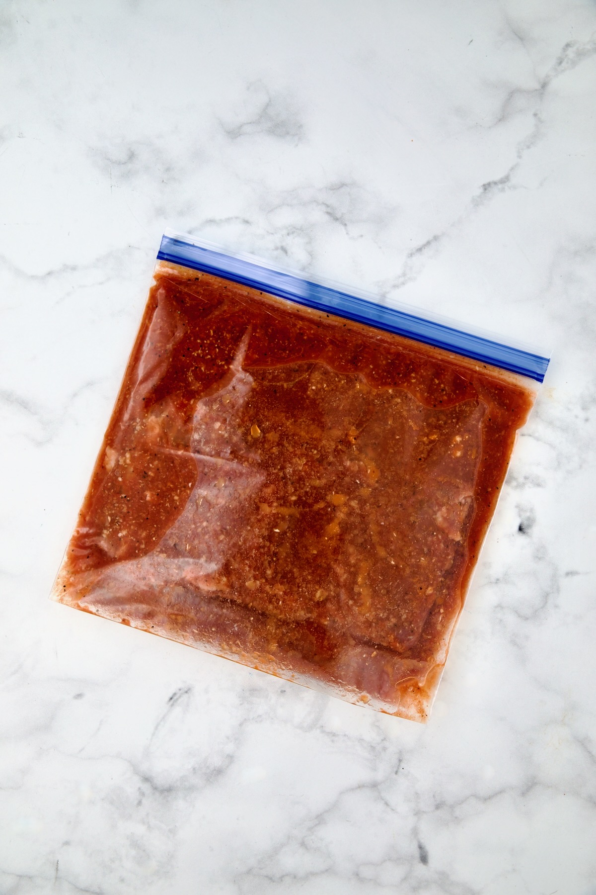 Bloody Mary marinade and skirt steak in gallon-size zipper-top bag.