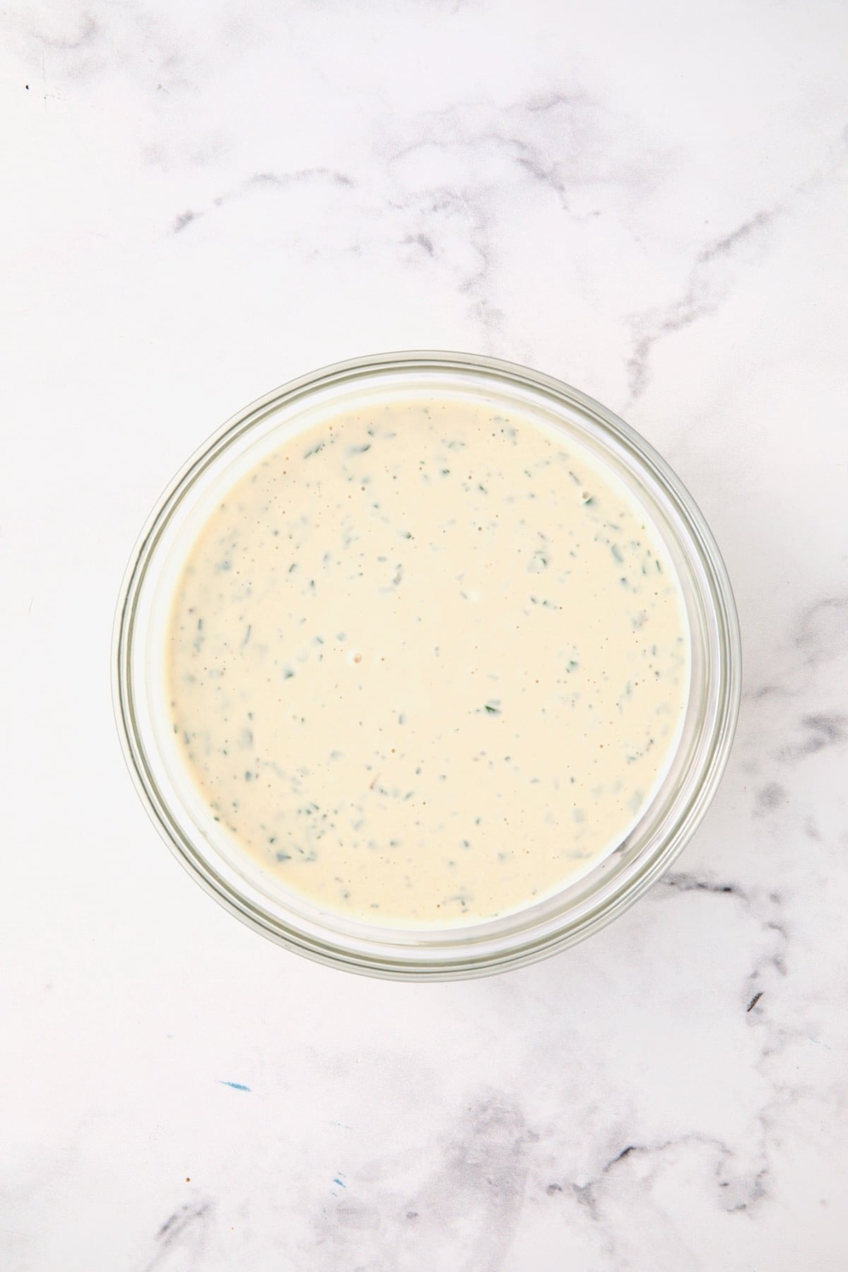Dressing for chicken salad in glass bowl.