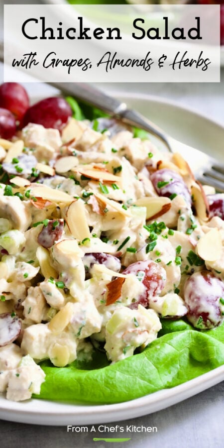 Pinterest graphic for Chicken Salad with Grapes, Almonds and Herbs showing it on a lettuce-lined white plate.
