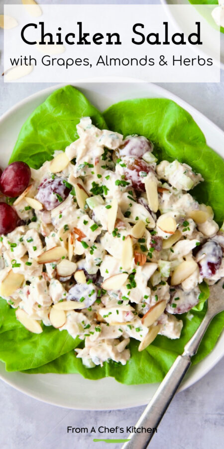 Pinterest graphic for Chicken Salad with Grapes, Almonds and Herbs showing it on a lettuce-lined white plate.