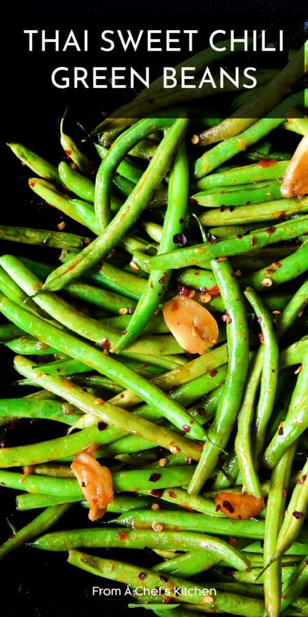 Pinterest graphic for Thai Sweet Chili Green Beans showing them up close with garlic slices.