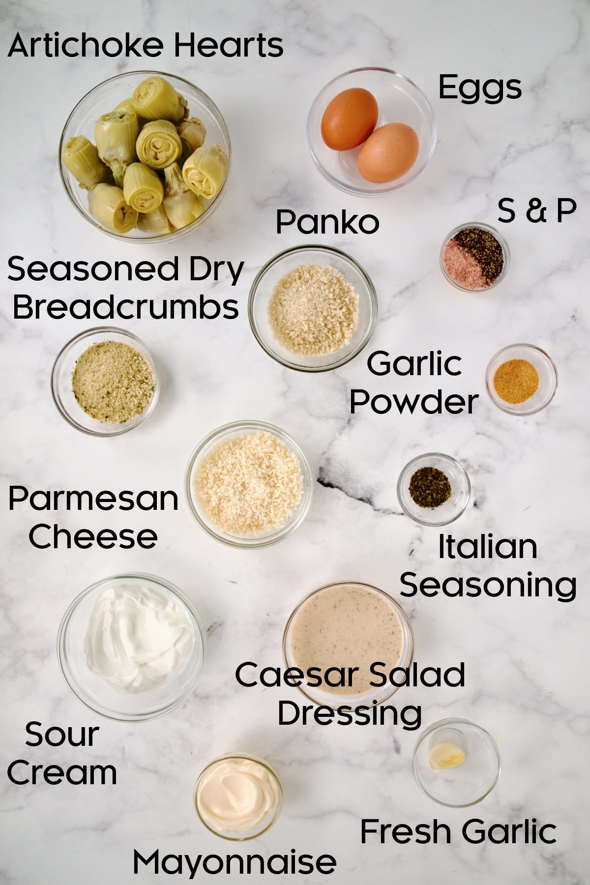 Ingredients for Crispy Parmesan Artichoke Hearts and Caesar Dip in glass bowls.