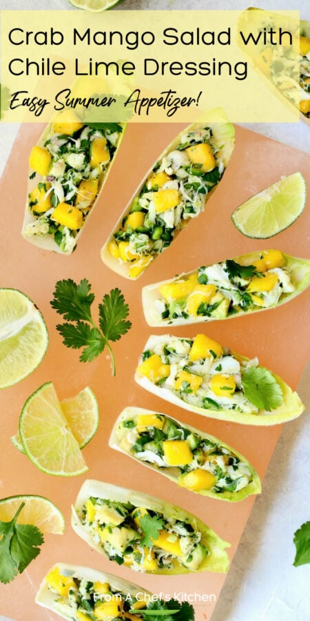 Pinterest graphic for Crab Mango and Avocado Salad showing it on a pink salt board garnished with lime and cilantro.