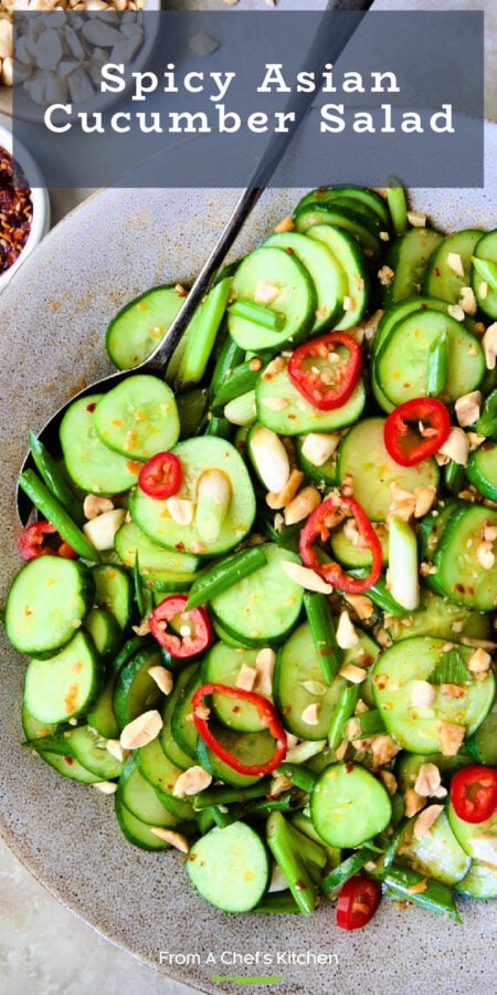 Pinterest graphic for Spicy Asian Cucumber Salad showing it in an earthenware bowl with serving spoon.