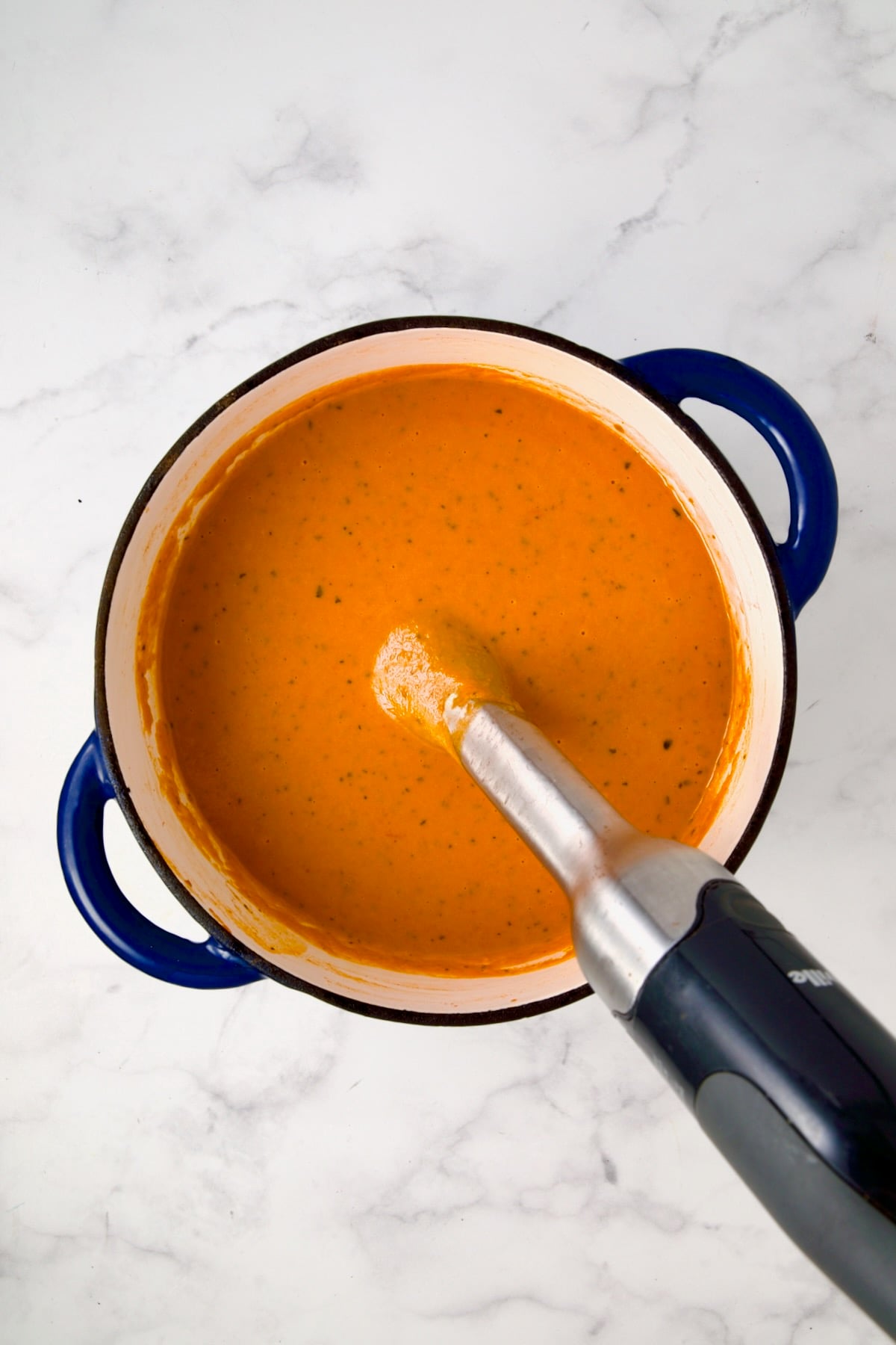 Pureed Creamy Tomato and Basil Soup with immersion blender.
