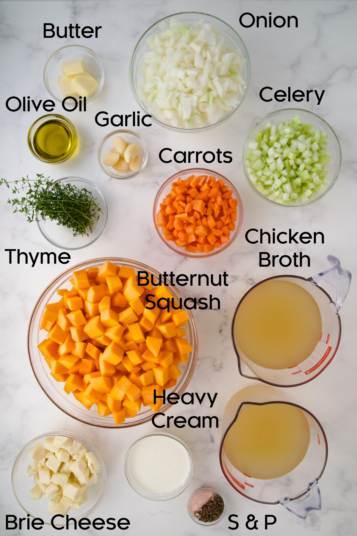 Ingredients for Butternut Squash Brie Soup in glass bowls.