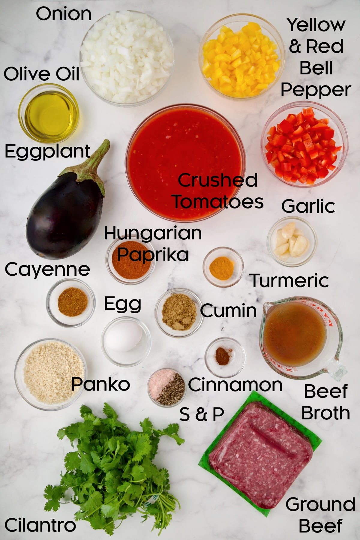 Ingredients for Moroccan Meatball Stew in glass bowls.