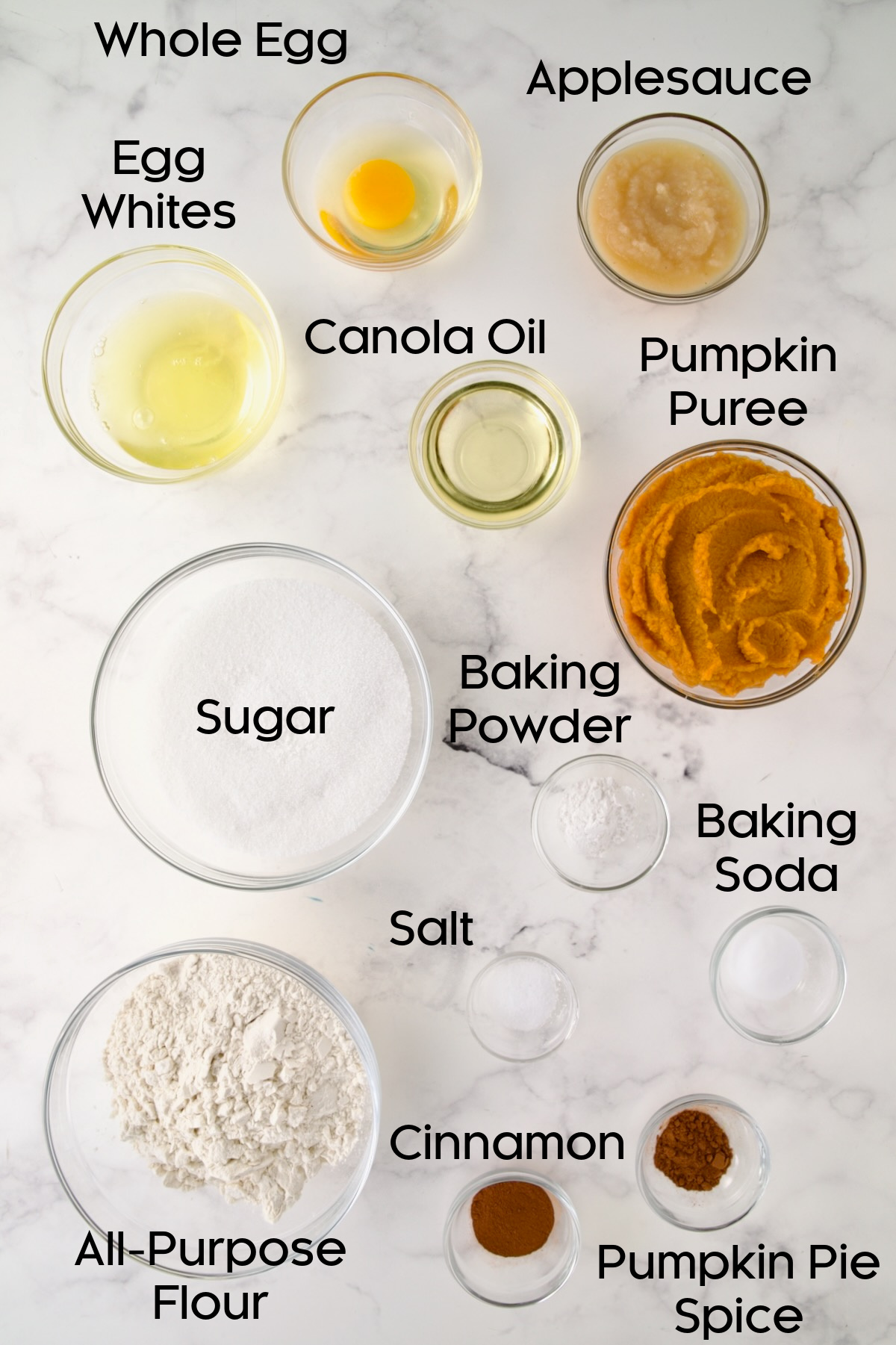 Ingredients for Pumpkin Streusel Muffins in glass bowls.