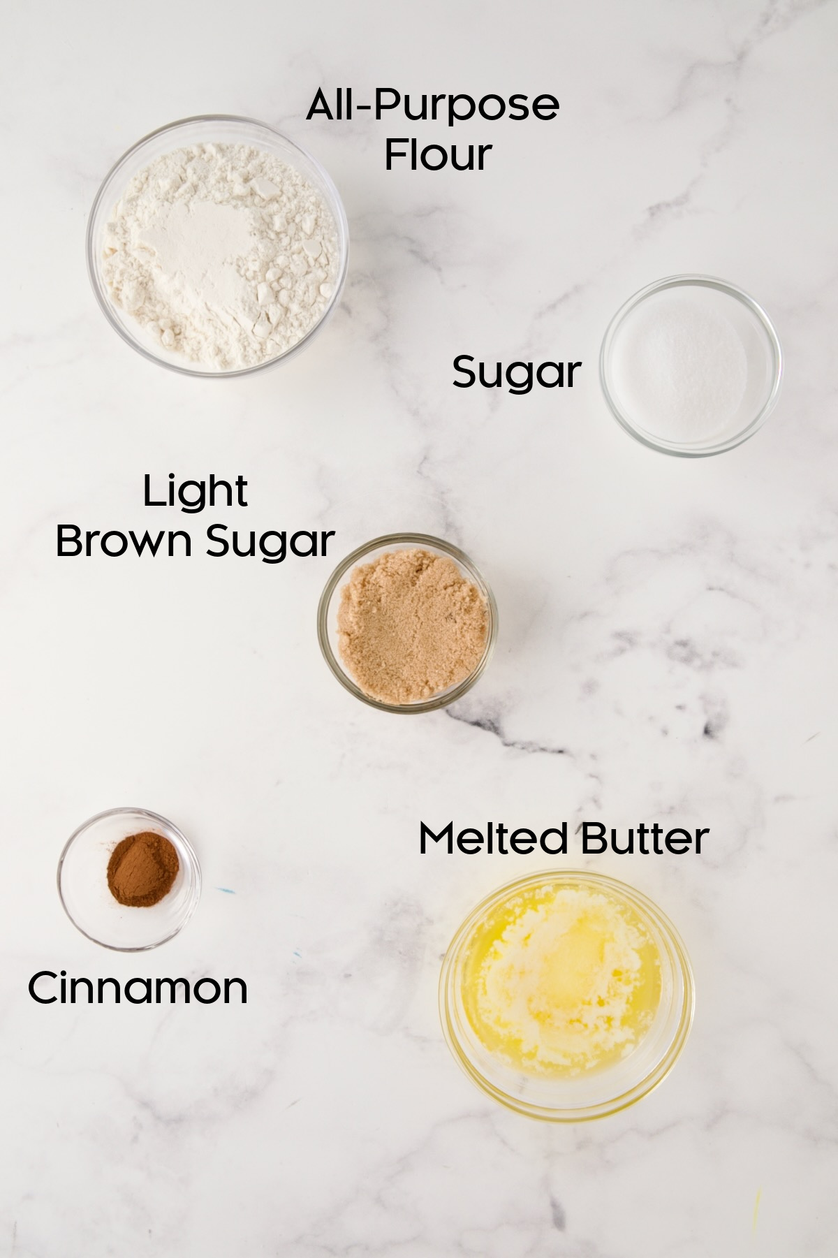Ingredients for streusel in glass bowls.