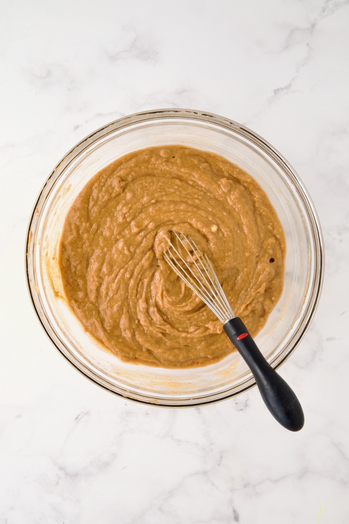 Batter for muffins in glass bowl.