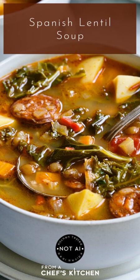 Pinterest graphic showing Spanish Lentil Soup showing one serving in a white bowl with soup spoon.