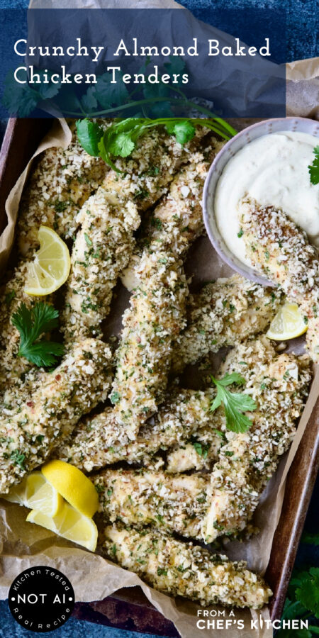 Pinterest graphic for Crunchy Almond Baked Chicken Tenders showing them in a metal parchment paper lined pan.