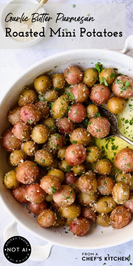 Pinterest graphic for Garlic Butter Parmesan Mini Potatoes showing them in a round white baking dish with serving spoon.