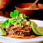 Salmon Tostadas on white plate.