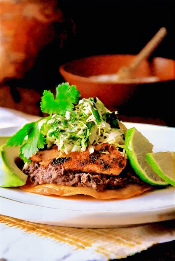 Salmon Tostadas on white plate.