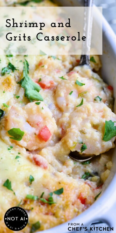 Pinterest graphic for Shrimp and Grits Casserole showing it whole in an oval white baking dish with a serving spoon scooping up some of the shrimp.