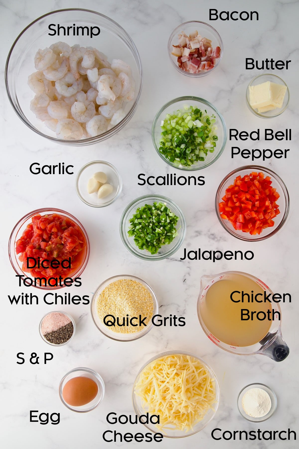 Ingredients for Shrimp and Grits Casserole in glass bowls.