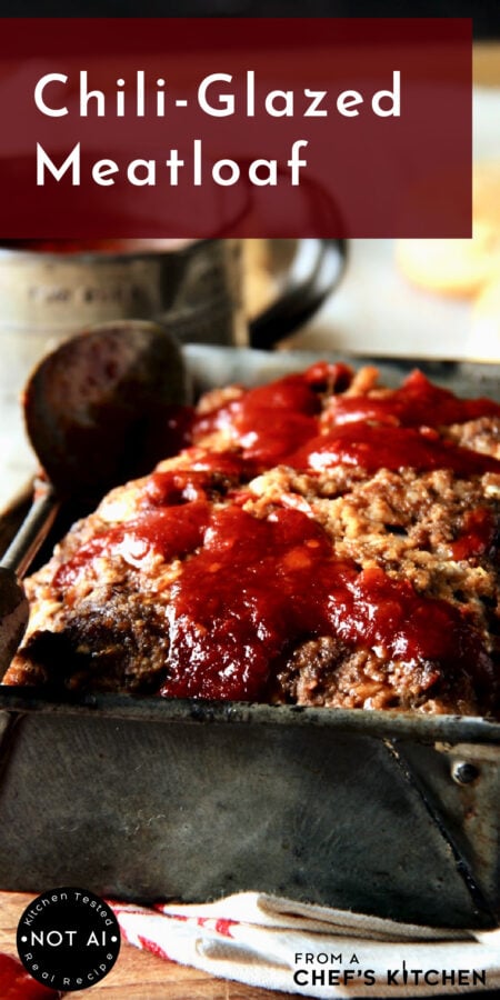 Pinterest graphic for Chili-Glazed Meatloaf showing it in a vintage loaf pan with the glaze scattered over it.