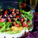 Seven Layer Dip in glass bowl.