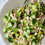 Italian Broccoli Salad in earthenware bowl with serving fork.