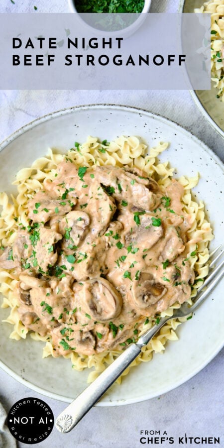 Pinterest graphic for Date Night Beef Stroganoff showing it in an earthenware bowl over egg noodles.