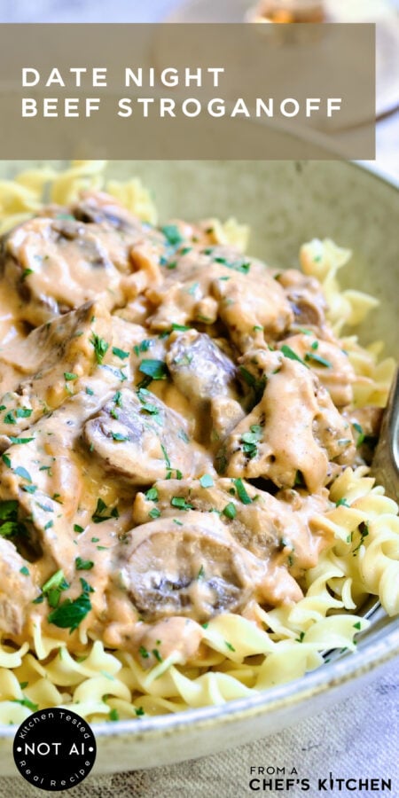 Pinterest graphic for Date Night Beef Stroganoff showing it in an earthenware bowl over egg noodles.