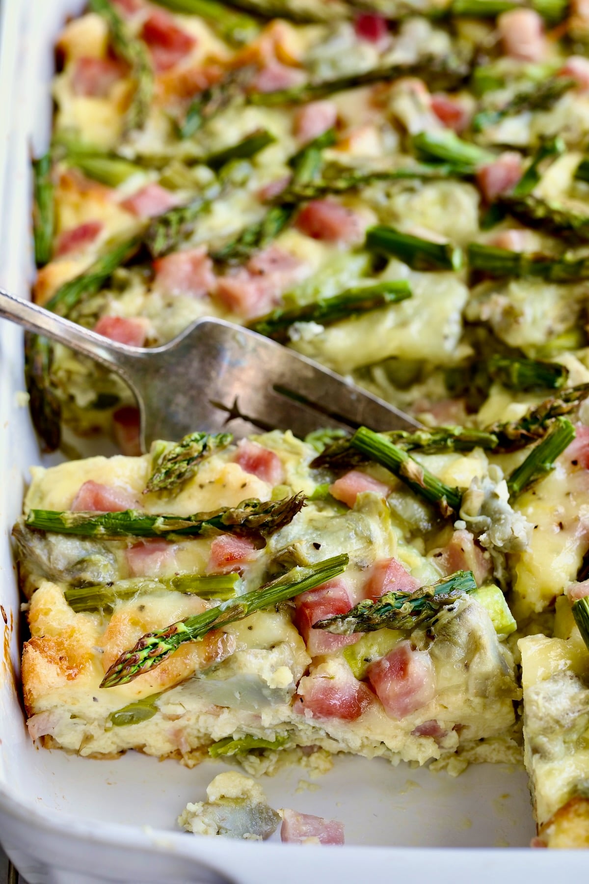 Close-up of a piece of Brioche Breakfast Strata.