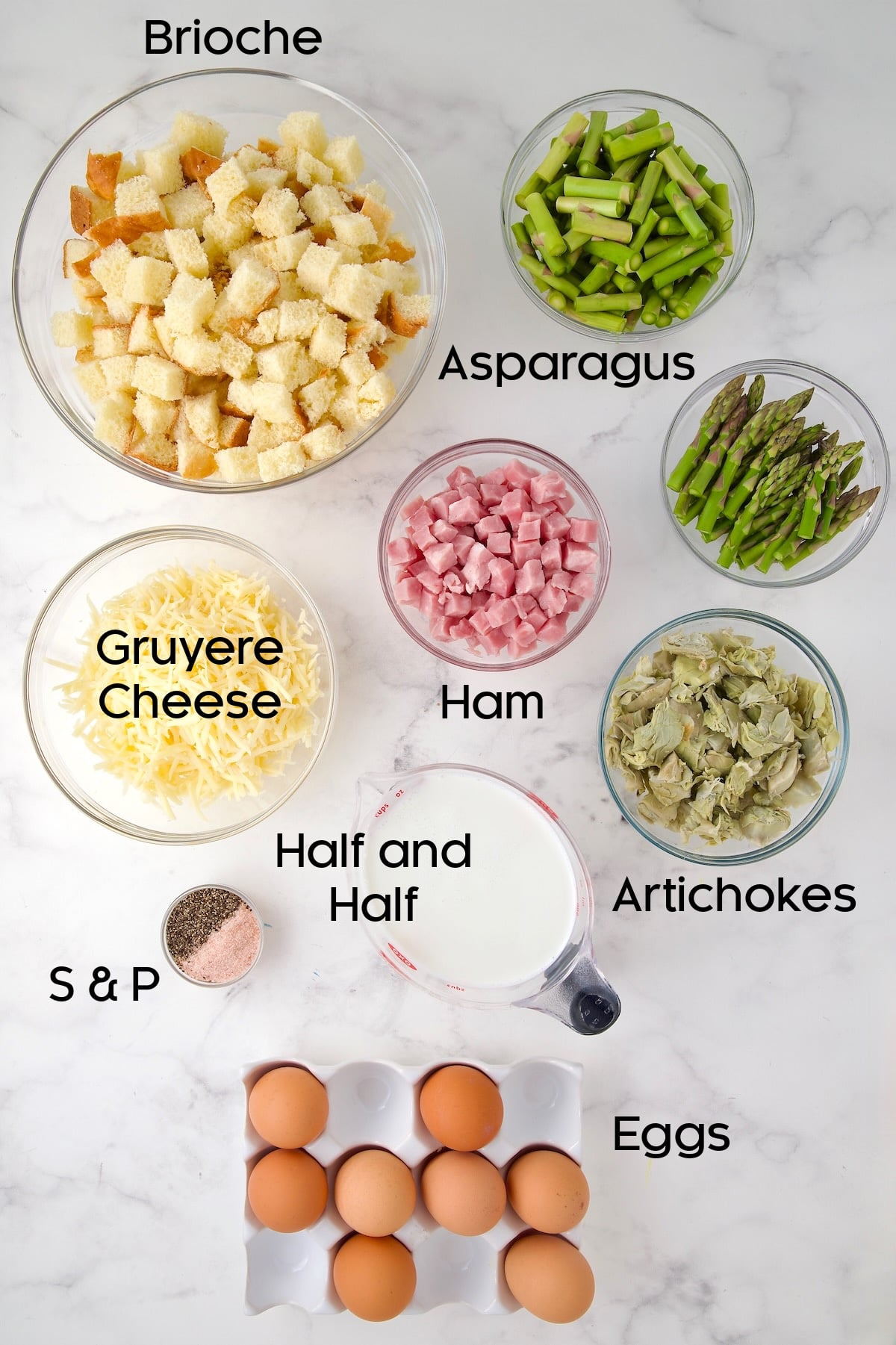 Ingredients for Brioche Breakfast Strata in glass bowls.