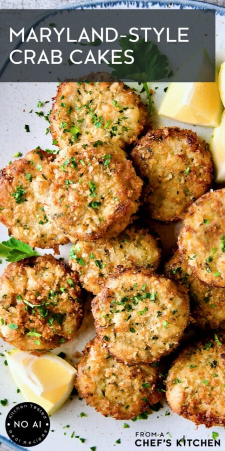 Pinterest graphic for Maryland-Style Crab Cakes showing them on a platter with lemon wedges.