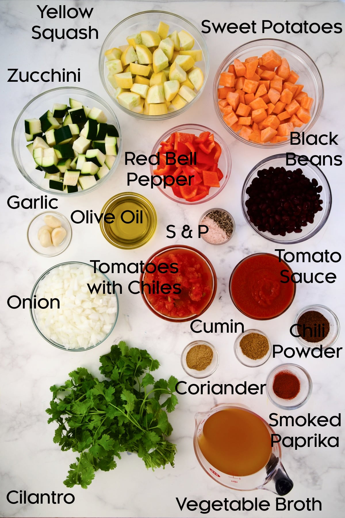 Ingredients for Roasted Vegetable Stew in glass bowls.