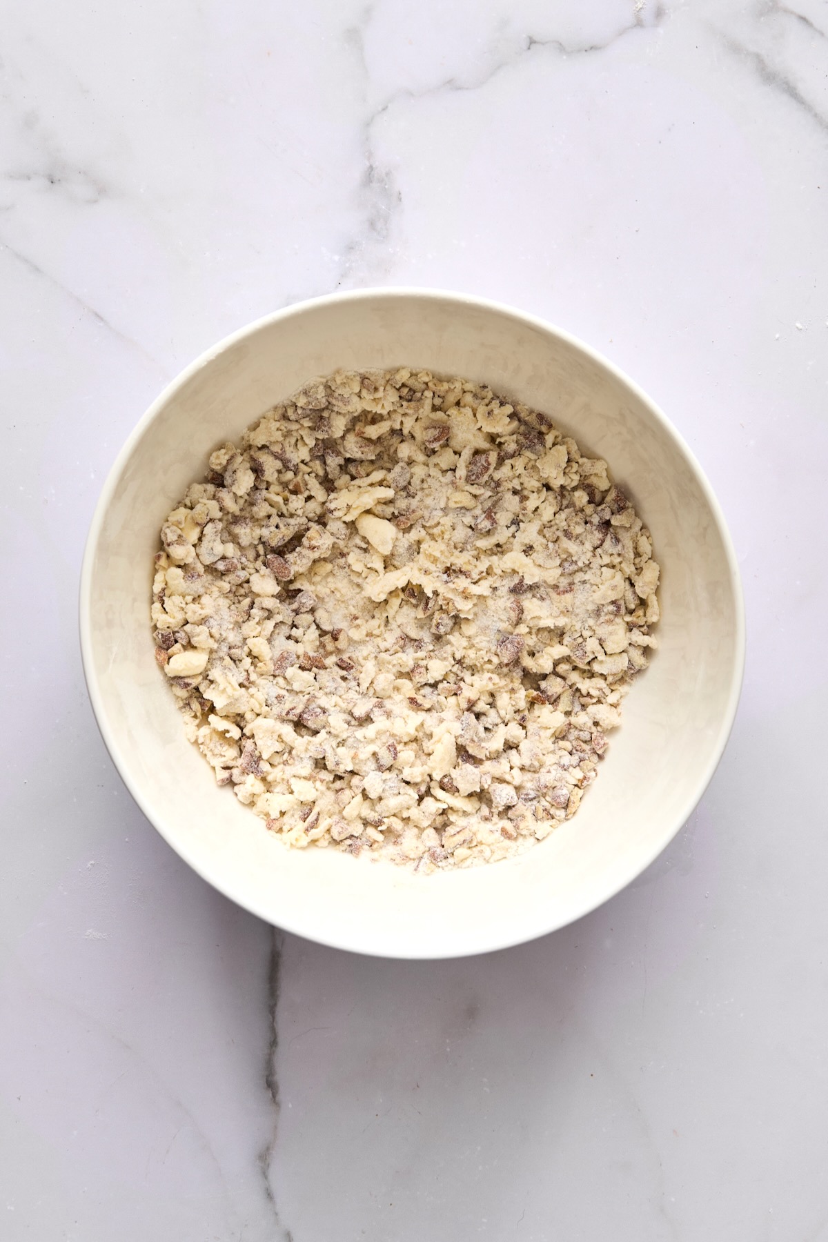 Streusel topping for coffee cake in white bowl.