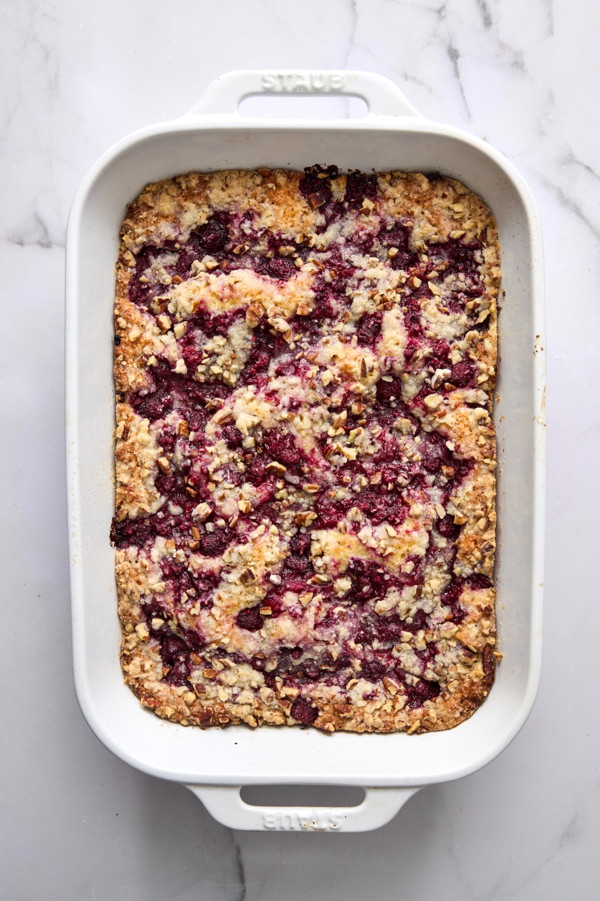 Baked Easy Raspberry Coffee Cake in white rectangular baking dish.
