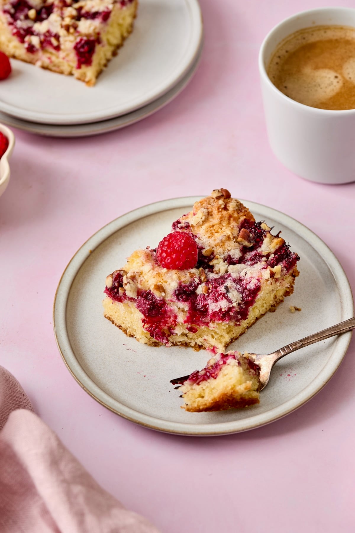 Piece of Easy Raspberry Coffee Cake on a white plate.