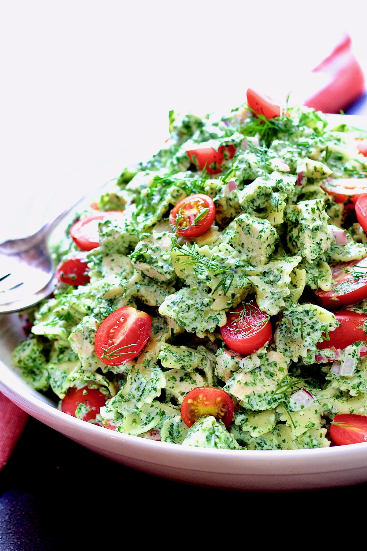 Chicken Bowtie Pasta Salad in white bowl.