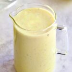 Creamy Lemon Dressing in glass pitcher.