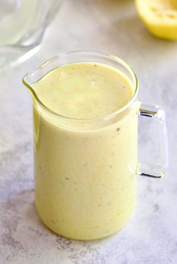 Creamy Lemon Dressing in glass pitcher.