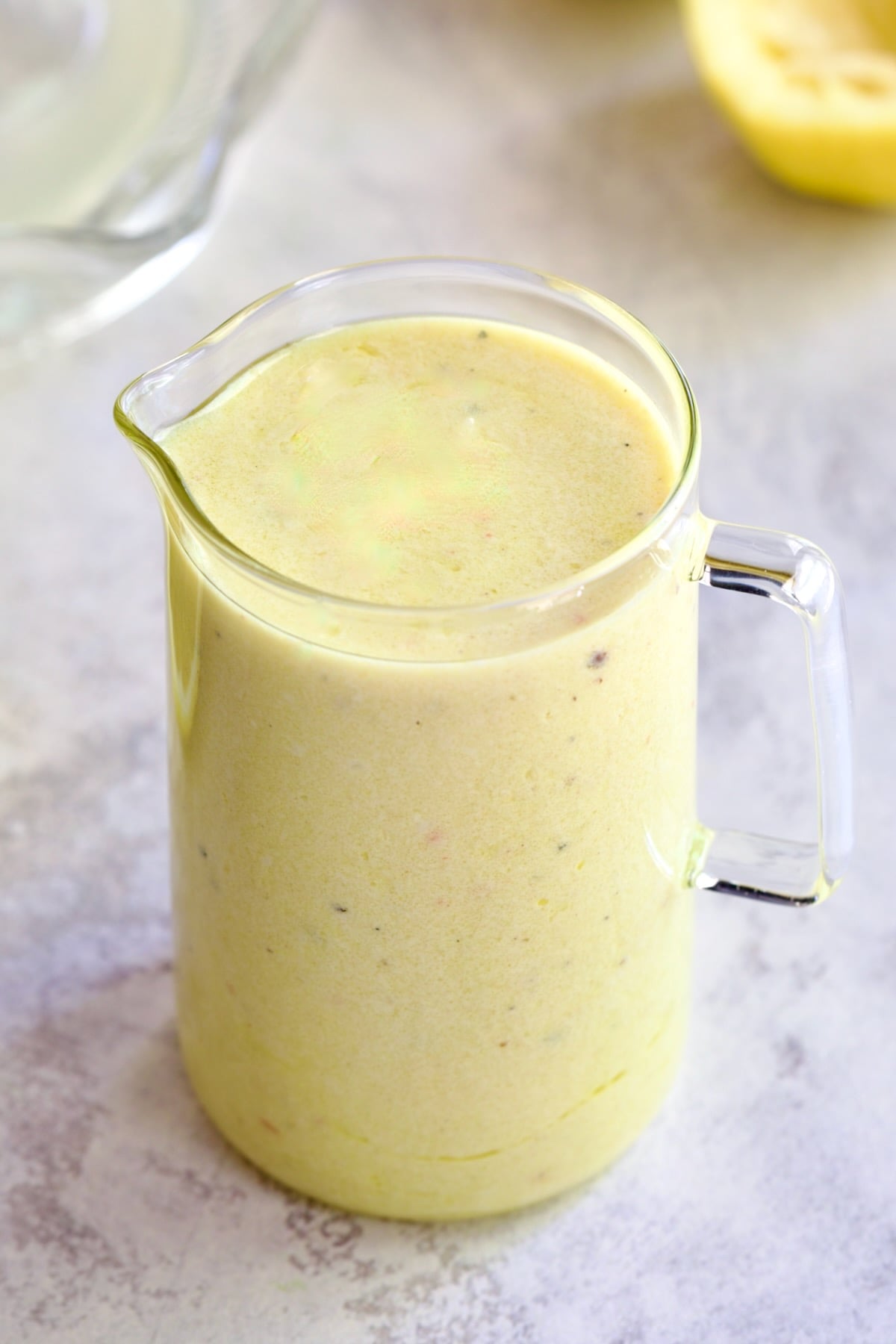 Creamy Lemon Dressing in glass pitcher.