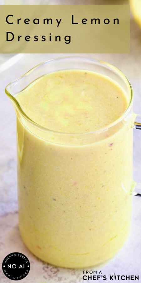Pinterest graphic for Creamy Lemon Dressing showing it in a small glass pitcher.