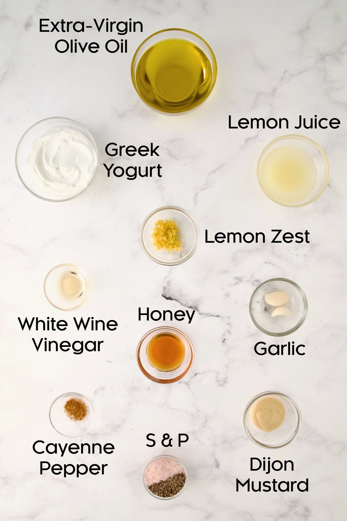 Ingredients for Creamy Lemon Dressing in glass bowls.
