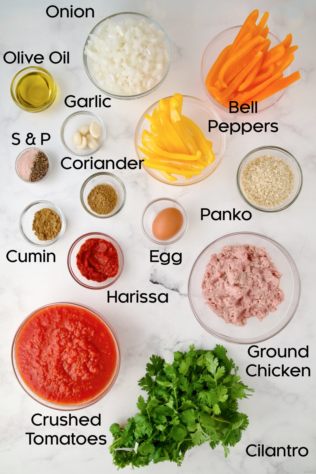 Ingredients for Harissa Chicken Meatballs in glass bowls.