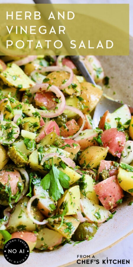 Pinterest graphic for Herb and Vinegar Potato Salad showing it in an earthenware bowl with serving spoon.