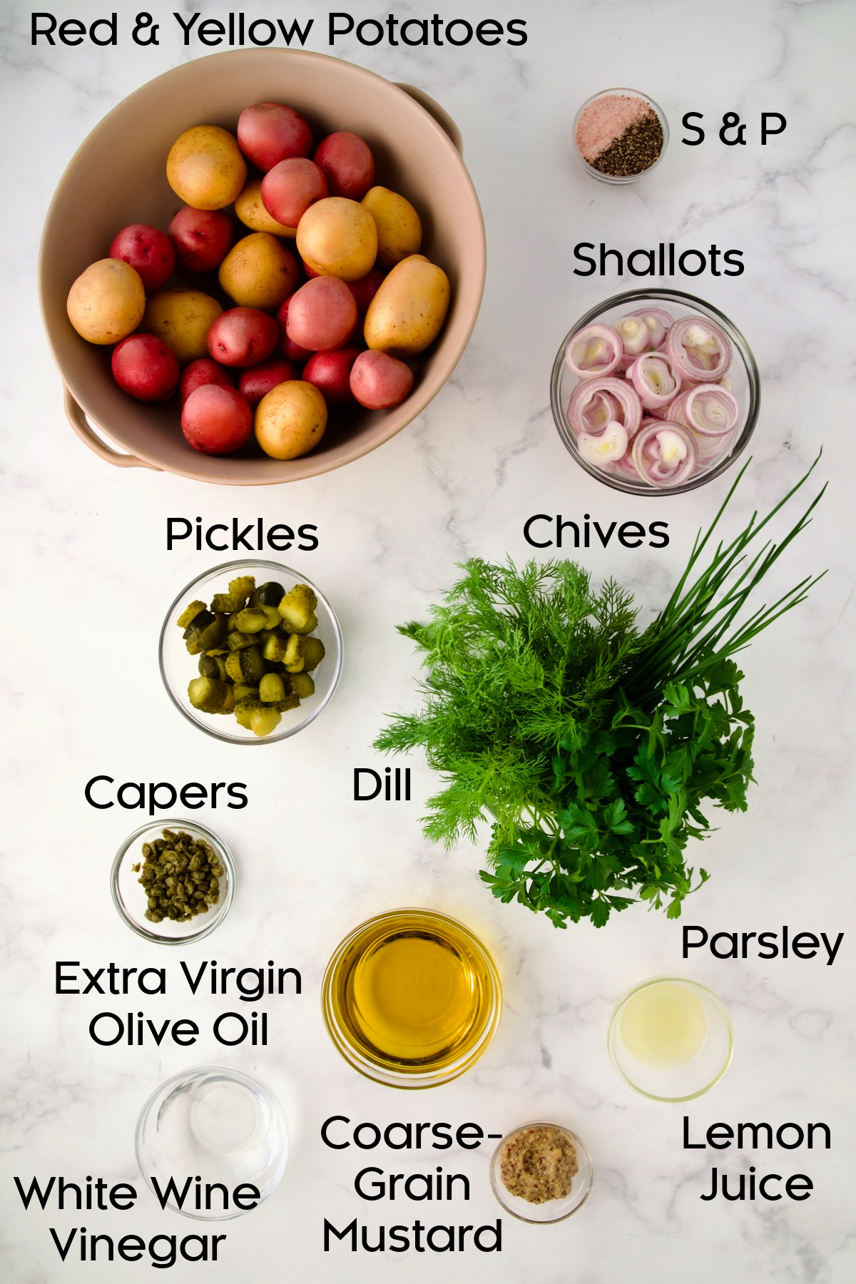 Ingredients for Herb and Vinegar Potato Salad in glass bowls.